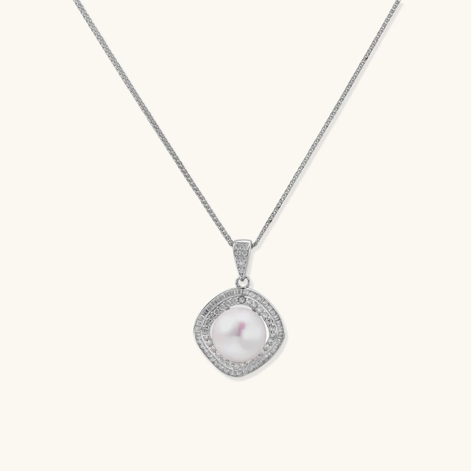 Cushion-shaped double halo pendant with 10mm freshwater pearl center on rhodium-plated sterling silver chain